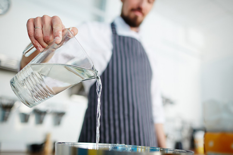 chef pouring water